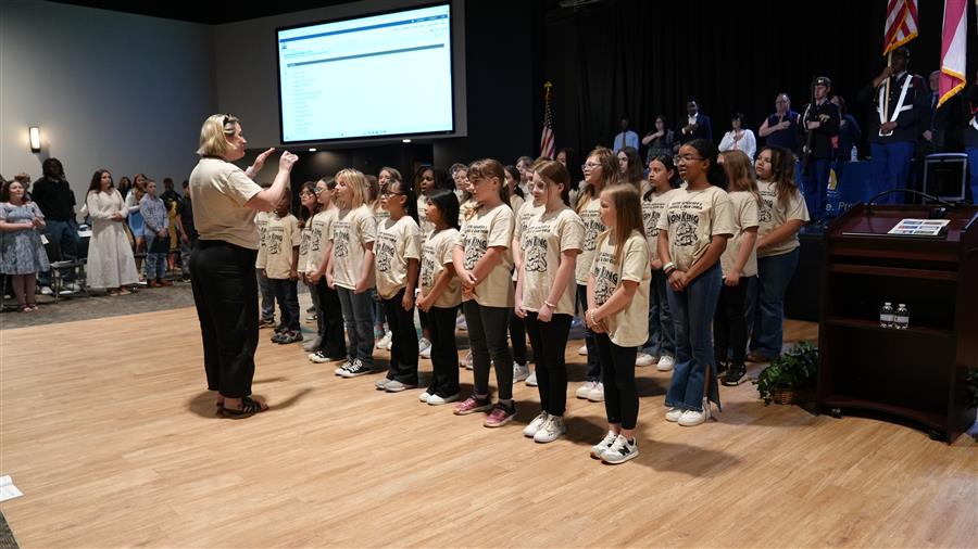 The Panter Elementary Show Choir under the direction of Karen Emerine performed during the meeting.