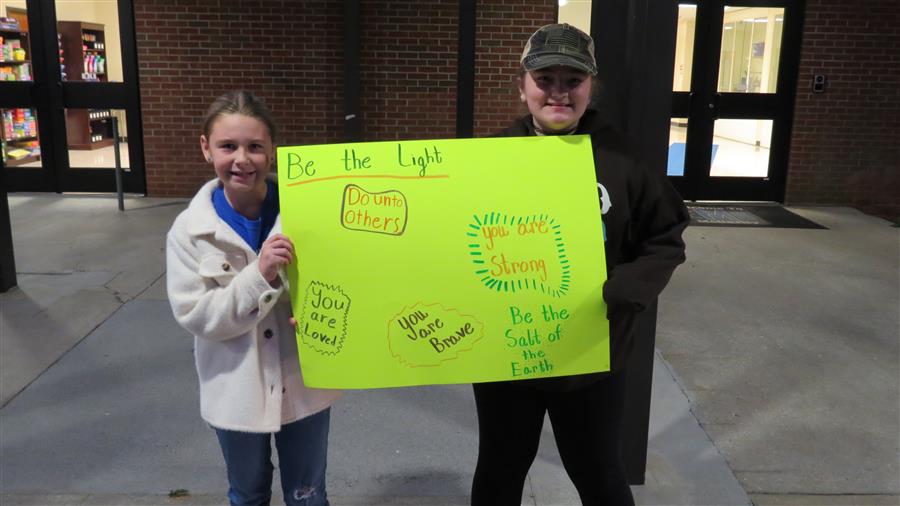 Student Holding Sign