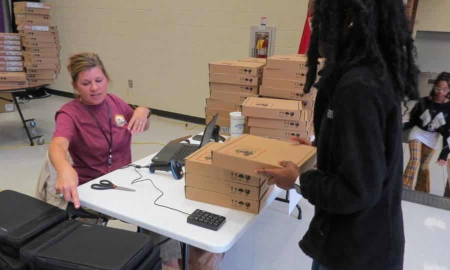 Student Waiting in Line for Laptop